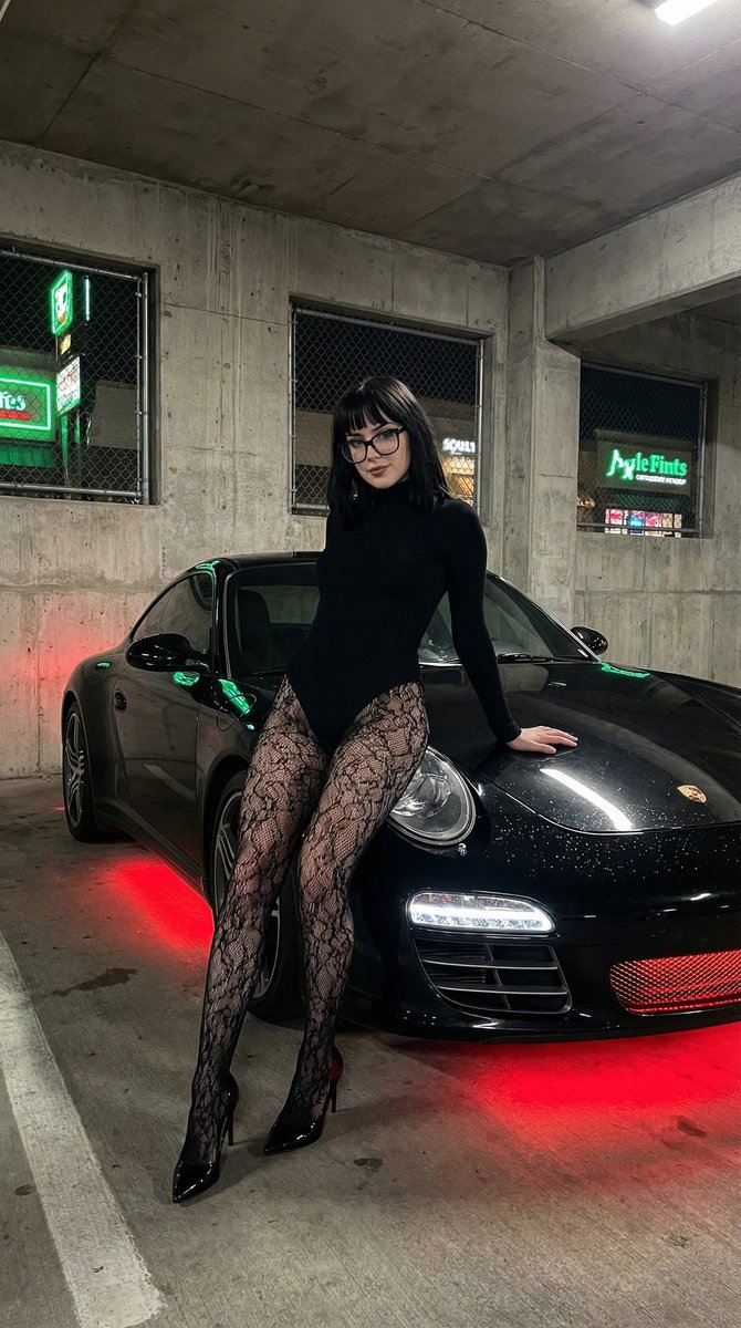 Close-up of a Confident Young Woman in an Indoor Parking Garage at Night, People, nanoBanana-Pro, Black Fashion, Black Porsche reference image