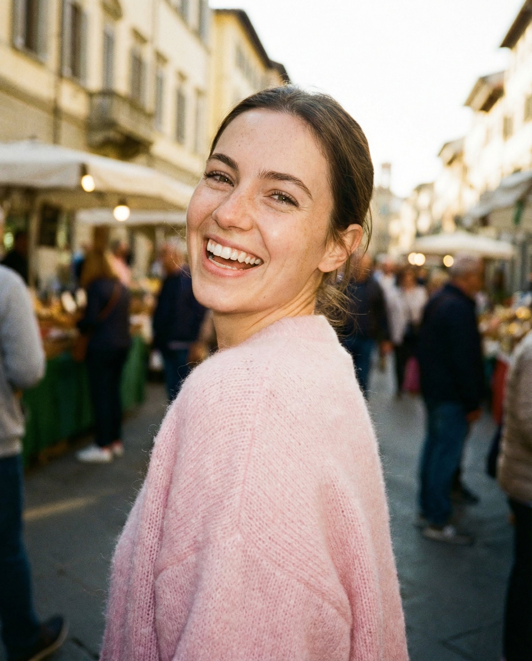 Sunlit Street Snap of a Young Woman in a European Marketplace